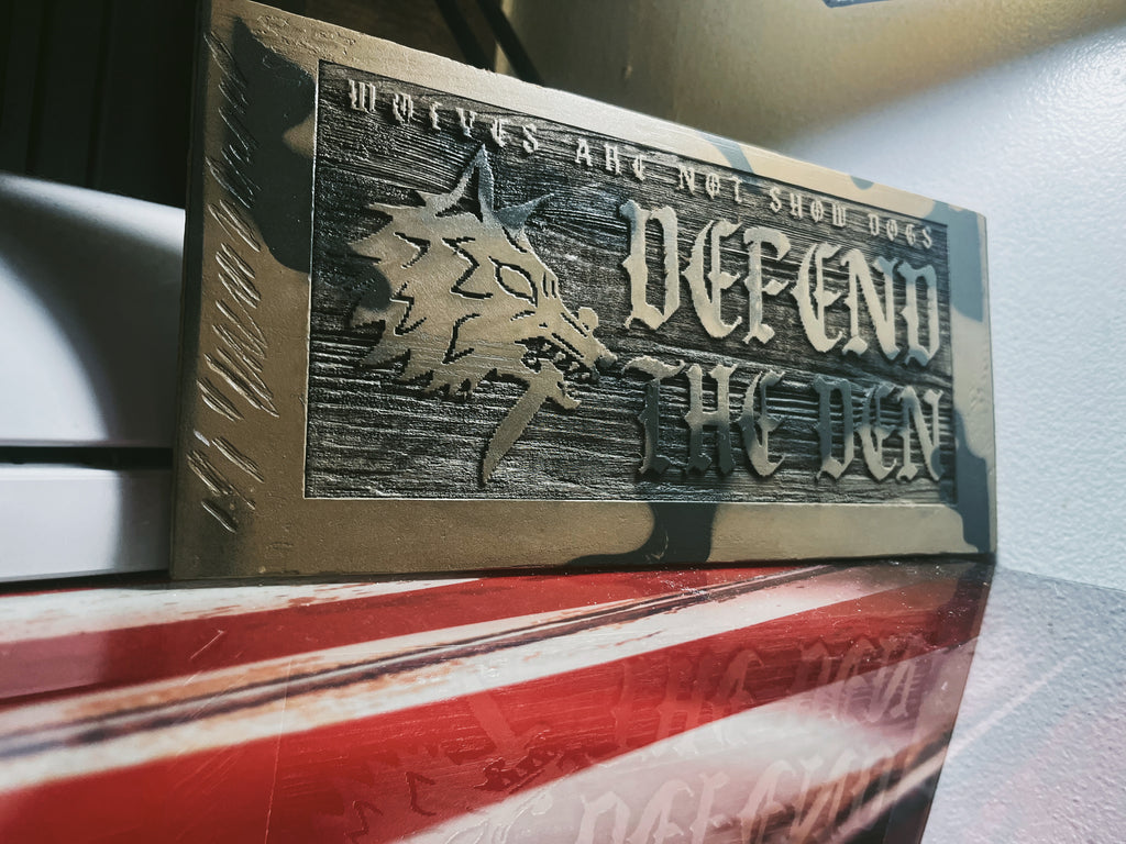 DEFEND THE DEN PLAQUE image 1